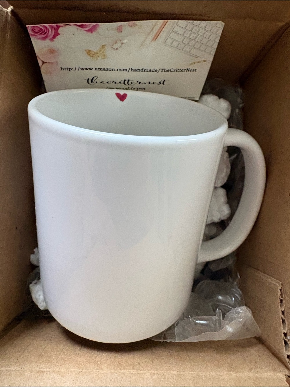 White Ceramic Mug with Small Pink Heart with EXPLICIT message inside.